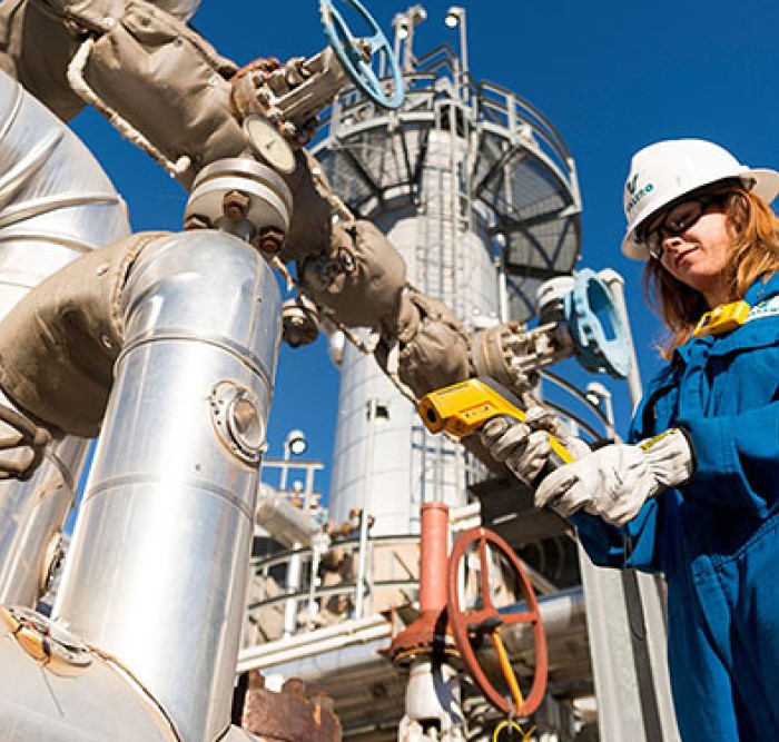 Operator looking down at equipment