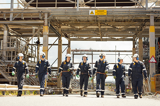 Engineers walk together at Valero's Pembroke Refinery.