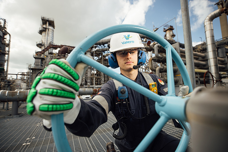 An engineer turns a wheel at Valero's Pembroke Refinery.