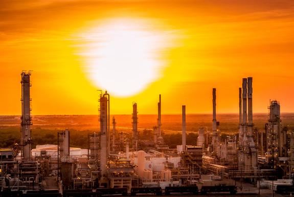 Refinery landscape silhouette image at sunset