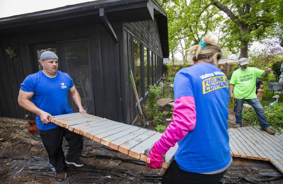 Volunteers moving large debris