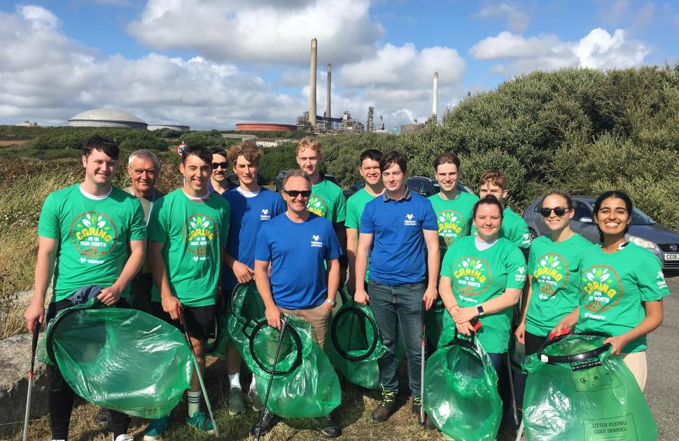Employees in Pembroke during a beach clean up