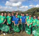 Employees in Pembroke during a beach clean up