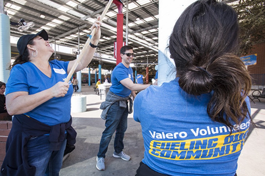 Valero Volunteers smile as they work on a volunteer project.